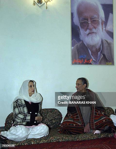 Pakistani former prime minister Benazir Bhutto talks with Talal Bugti , son of slain rebel tribal chief Nawab Akbar Bugti as Bugti son during a visit...