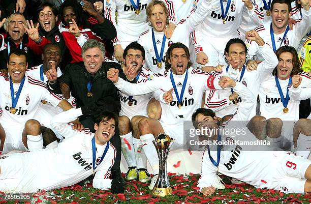 Kaka and Filippo Inzaghi with AC Milan players celebrate winning the FIFA Club World Cup final between Boca Juniors and AC Milan at the International...