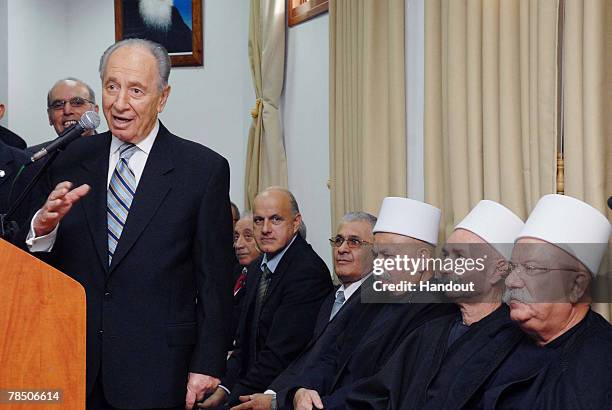 In this handout image supplied by the Israeli Government Press Office , Israeli President Shimon Peres talks while on a visit for the upcoming Eid...