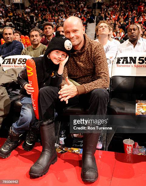 Canadian rocker Gord Downie, from the Tragically Hip, with his son enjoys a game between the Toronto Raptors and the Boston Celtics on December 16,...