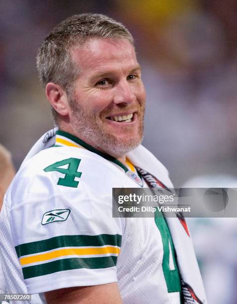 Brett Favre of the Green Bay Packers laughs while on the sideline against the St. Louis Rams at the Edward Jones Dome December 16, 2007 in St. Louis,...