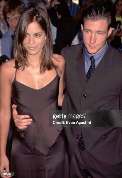 Actor, director, and writer Edward Burns arrives with Maxine Bahns at the premiere of "She's the One" in New York, NY, August 13, 1996.