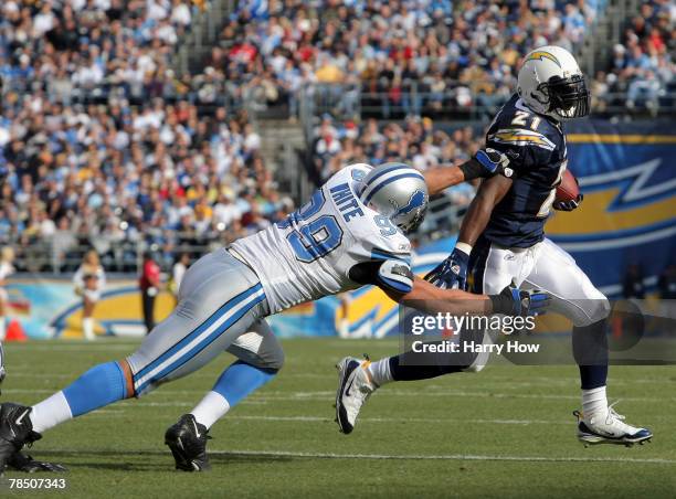 LaDainian Tomlinson of the San Diego Chargers beats Dewayne White of the Detroit Lions around the corner during the first quarter at Qualcomm Stadium...