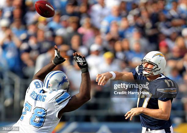 Philip Rivers of the San Diego Chargers passes over Cory Redding of the Detroit Lions during the second quarter at Qualcomm Stadium December 16, 2007...