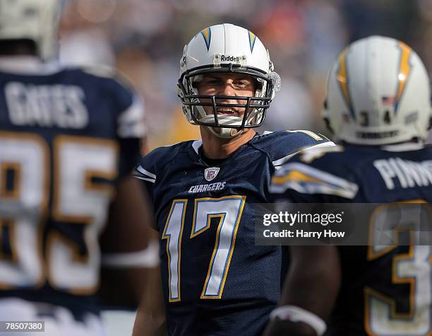 Philip Rivers of the San Diego Chargers talks to teammates Antonio Gates and Andrew Pinnock during their game against the Detroit Lions during the...