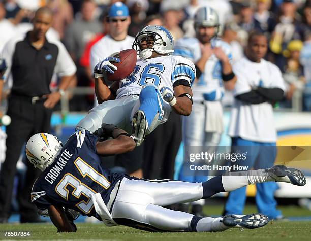 Aveion Cason of the Detroit Lions is tackled by Antonio Cromartie of the San Diego Chargers during the first quarter at Qualcomm Stadium December 16,...