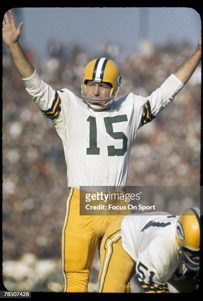 Quarterback Bart Starr of the Green Bay Packers tries to quiet the crowd during a circa 1960's NFL game. Starr played for the Packers from 1956 -71