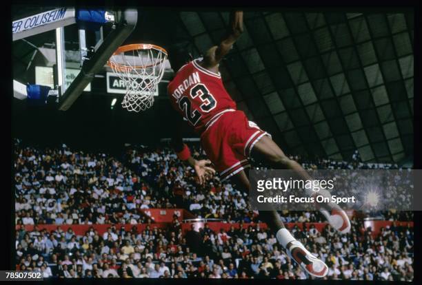 Michael Jordan of the Chicago Bulls goes for the slam dunk during a circa 1987 NBA basketball game. Jordan played for the Bulss from 1984-93 and 1995...