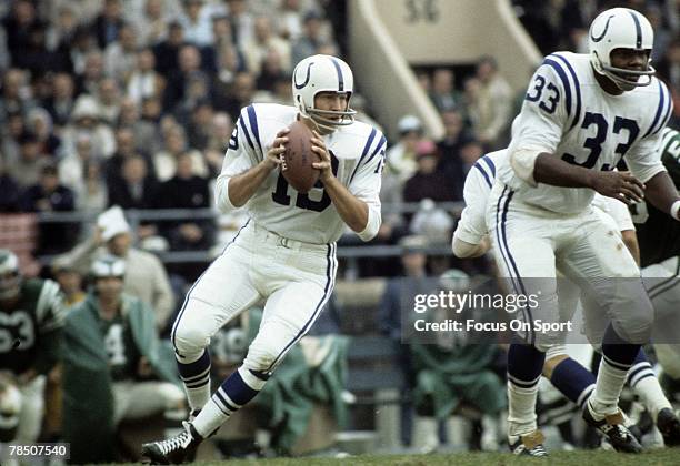 S: Quarterback Johnny Unitas of the Baltimore Colts drops back to pass against the Philadelphia Eagles during an early circa 1970's NFL football game...