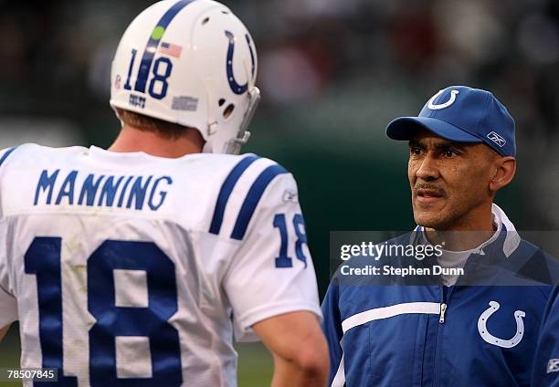 Head coach Tony Dungy and quarterback Peyton Manning of the Indianapolis Colts confer during the game against the Oakland Raiders at McAfee Coliseum...