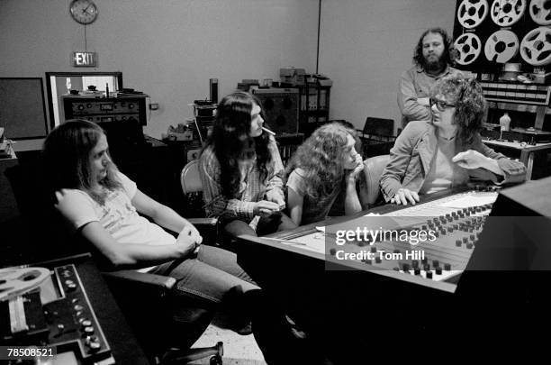 Lynyrd Skynyrd members Ronnie Van Zant, Gary Rossington and Allen Collins work with producer Al Kooper on "Pronounced Lynyrd Skynyrd" with engineer...