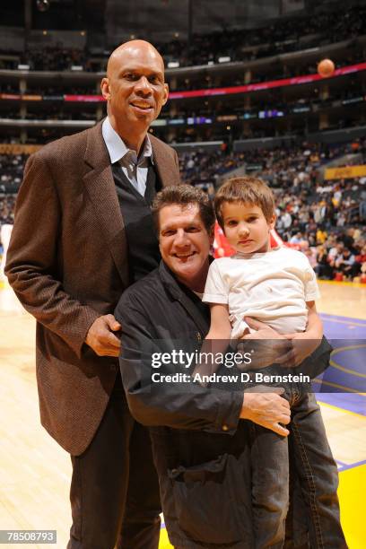 Musician Glenn Frey of the Eagles poses with his son and Kareem Abdul-Jabbar during the game between the Los Angeles Clippers and the Los Angeles...