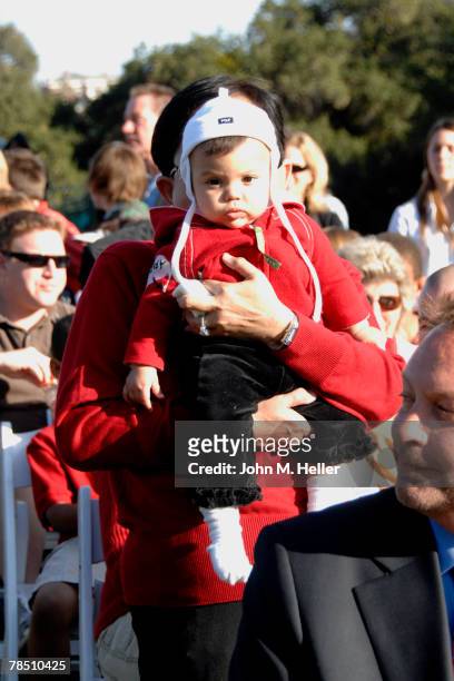 Tiger Woods mother, Kultida Woods holds her granddaughter, Sam Alexis Woods, on her lap while watching her son win his second consecutive and fourth...