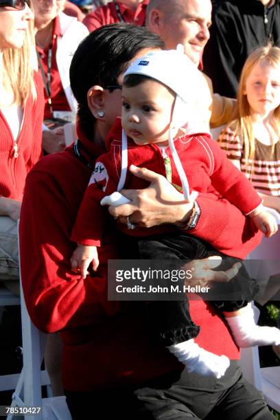 Tiger Woods' mother, Kultida Woods holds her granddaughter, Sam Alexis Woods, on her lap while watching her son win his second consecutive and fourth...