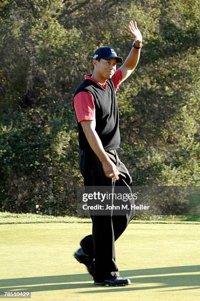 Tiger Woods waves to the thousands of people attending the the final round of play at the Target World Challenge at Sherwood Country Club on December...