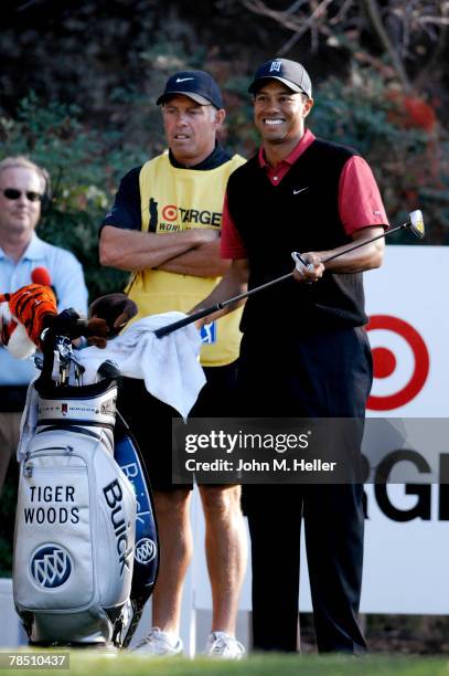 Tiger Woods atands with his caddy Steve Williams on the 18th tee knowing that he has won his fourth Target World Challenge with a seven stroke lead...