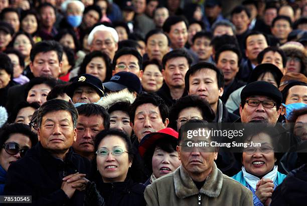 Supporters await the arrival of Presidential candidate Lee Myung-Bak of the conservative main opposition Grand National Party , during presidential...