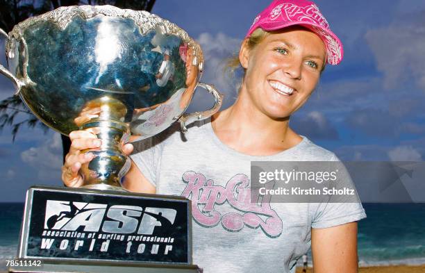 Women's World Champion Stephanie Gilmore of Australia poses with her trophy, following her recent win at the Billabong Girls Pro, at an impromptu...