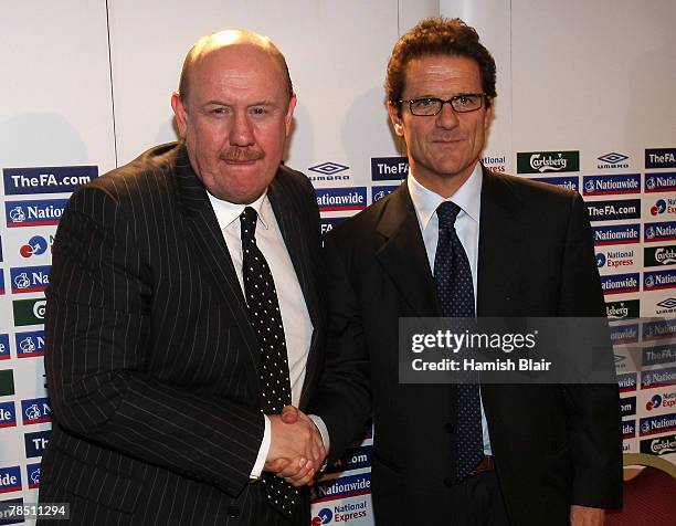 New England manager Fabio Capello poses with FA Chief Executive Brian Barwick after an FA Press Conference held at the Royal Lancaster Hotel on...