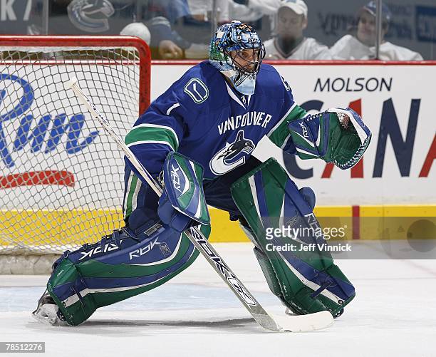 Goaltender Roberto Luongo of the Vancouver Canucks readies himself for a shot during the game against the Pittsburgh Penguins at General Motors Place...