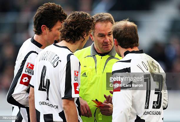 Referee Helmut Fleischer talks to the players of Moenchengladbach during the 2nd Bundesliga match between Borussia Moenchengladbach and SC Paderborn...