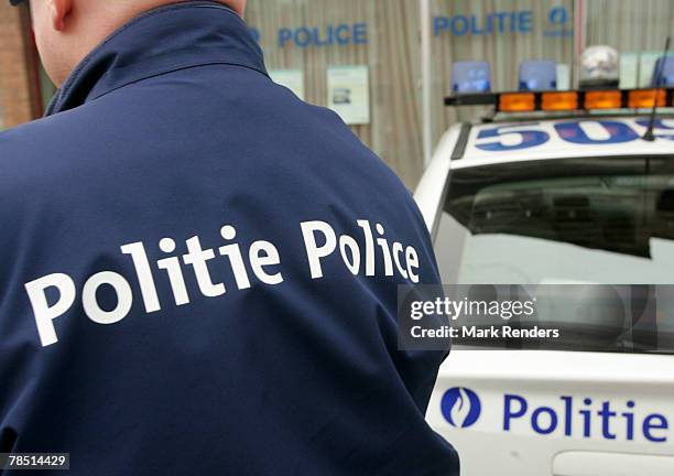 The logo on a police uniform is written in both French and Flemish on December 17, 2007 in Brussels, Belgium. French speaking Walloons are resisting...