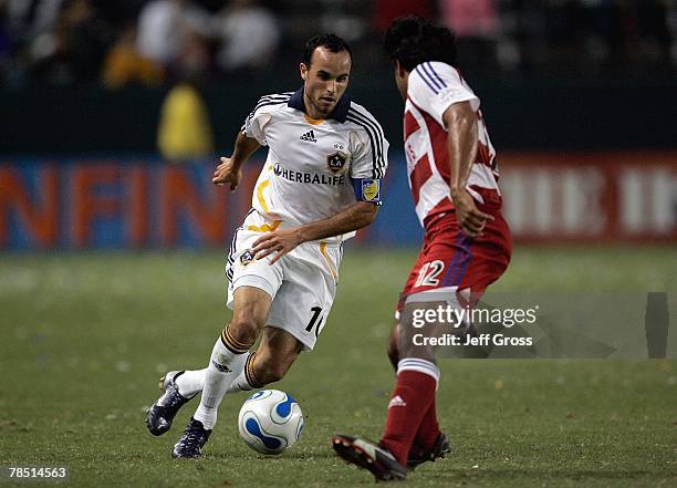 Landon Donovan of the Los Angeles Galaxy takes on a FC Dallas defender on September 23, 2007 at the Home Depot Center in Carson, California .