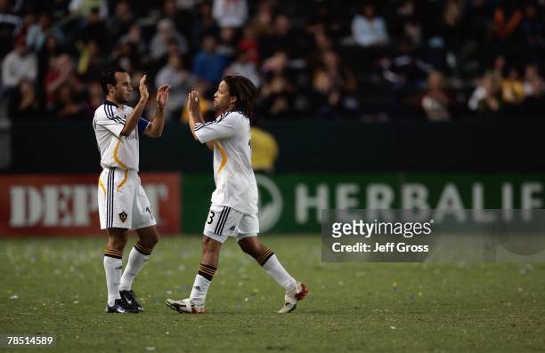 Cobi Jones of the Los Angeles Galaxy is congratulated by Landon Donovan after being substituted during the game against FC Dallas on September 23,...