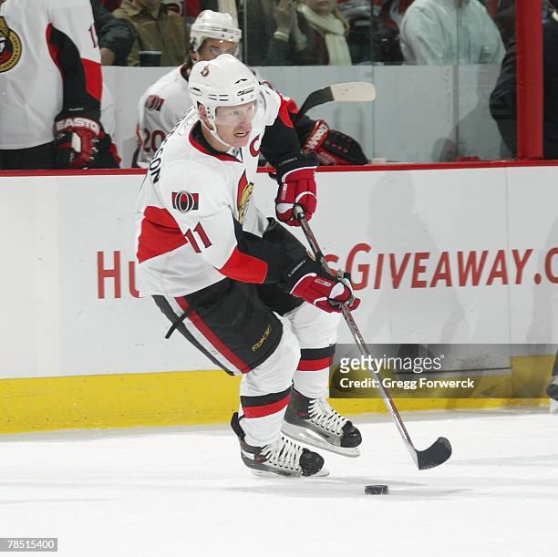 Daniel Alfredsson of the Ottawa Senators carries the puck during their game against the Carolina Hurricanes at RBC Center in Raleigh, North Carolina...