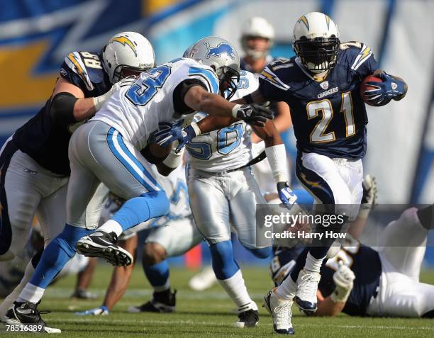 LaDainian Tomlinson of the San Diego Chargers rushes passed a tackle against the Detroit Lions on December 16, 2007 at Qualcomm Stadium in San Diego,...