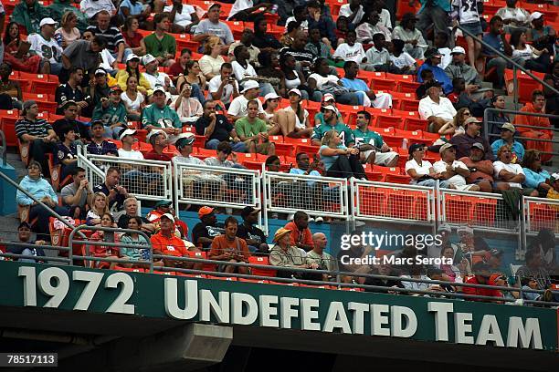 Fans sit above the ring of honor tribute during a ceremony for the 1972 undefeated Miami Dolphins at half time against the Baltimore Ravens December...