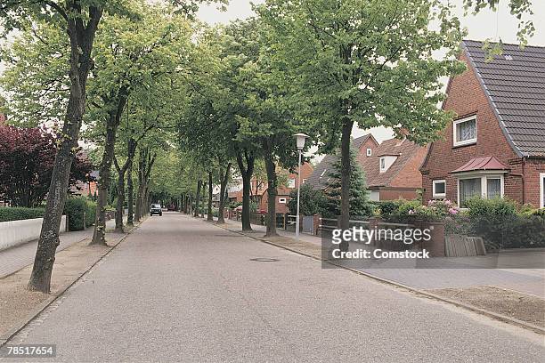 suburban street , marne , germany - suburban street stock-fotos und bilder