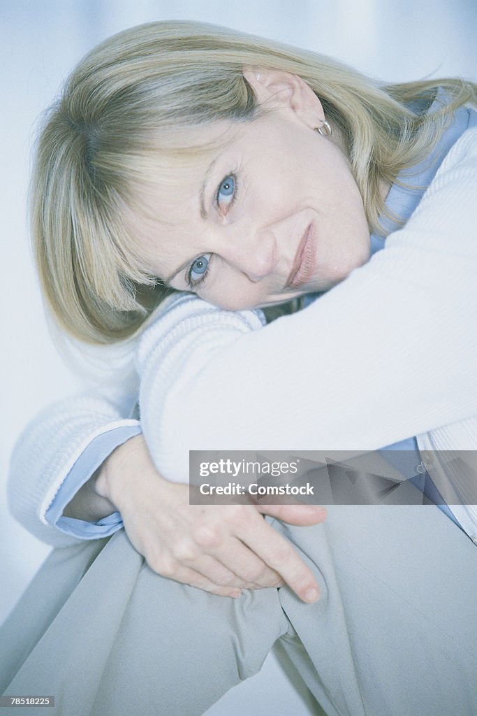 Woman posing curled up