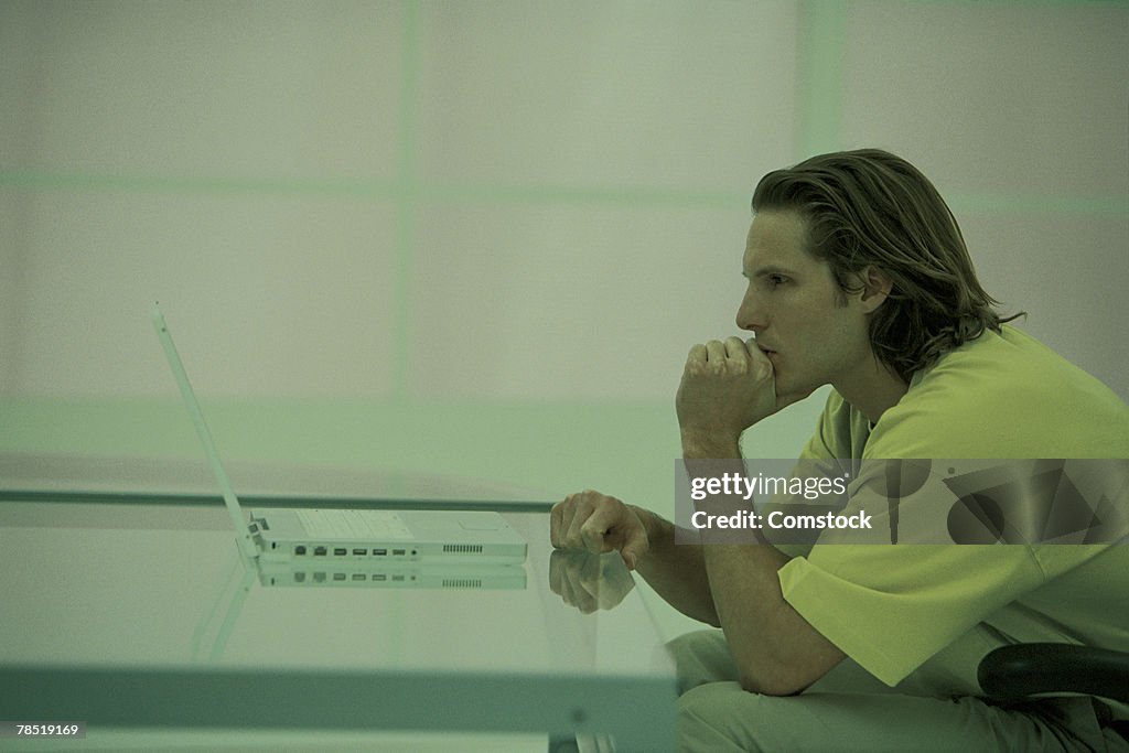 Man working on laptop computer