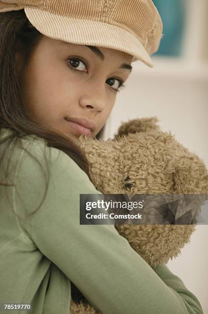 teenage girl with teddy bear - kuscheldecke stock-fotos und bilder
