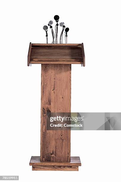 podium with microphones - podium microphone stock pictures, royalty-free photos & images