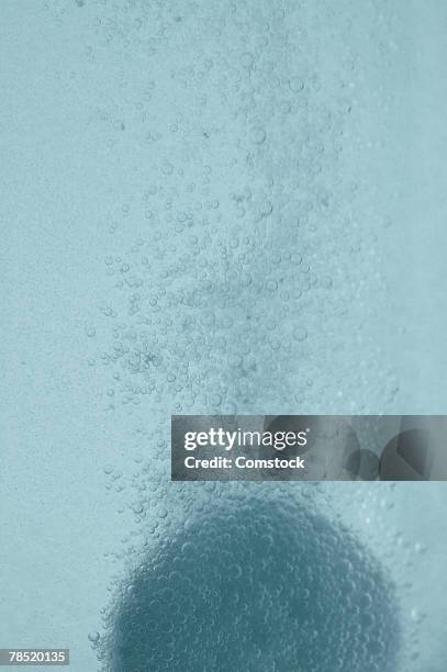 tablet dissolving in water - effervescent tablet stock pictures, royalty-free photos & images