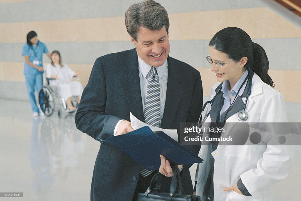 Doctor talking with businessman
