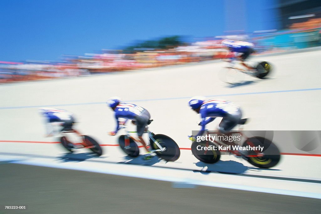 Team cycling race, elevated view (blurred motion)