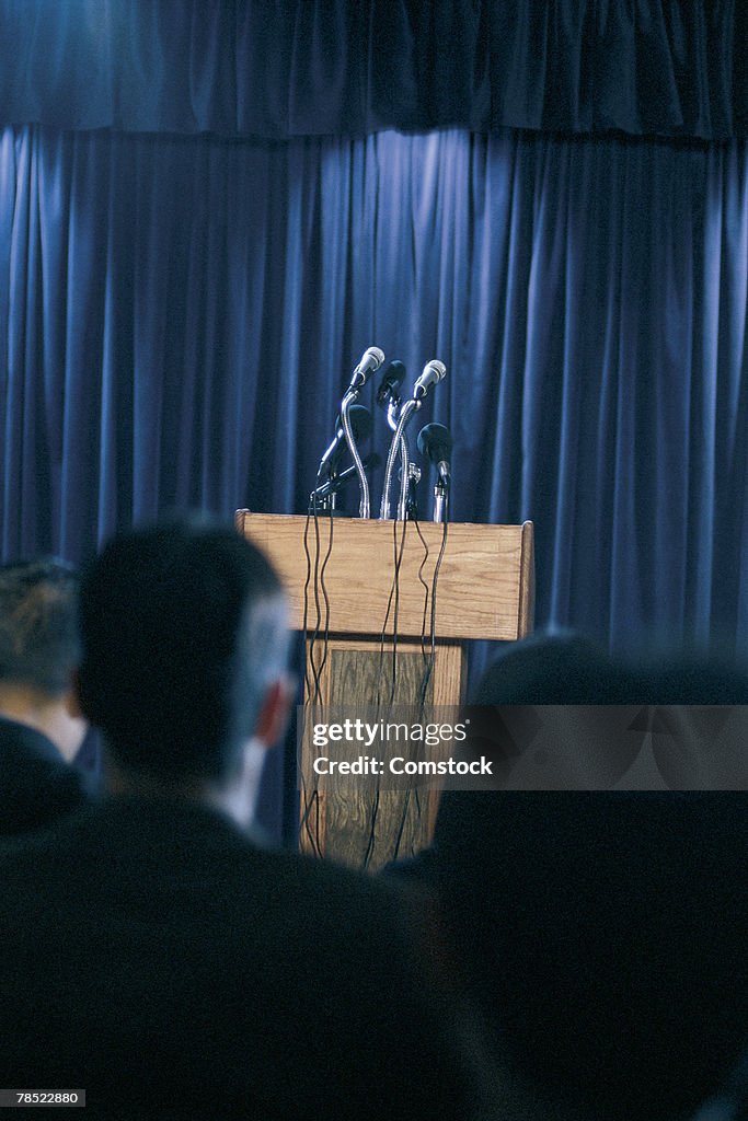 Empty podium with audience waiting