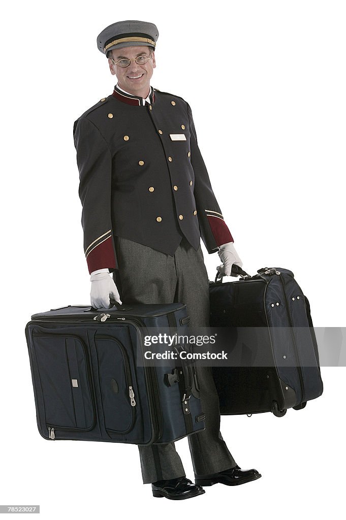 Bellhop posing with luggage