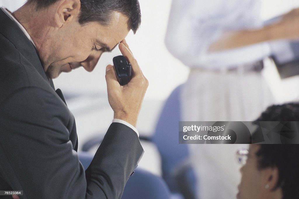 Frustrated businessman with cell phone