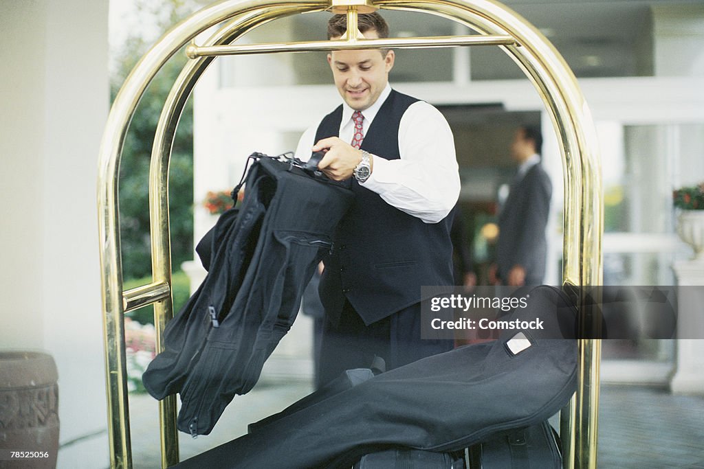 Bellboy with luggage cart