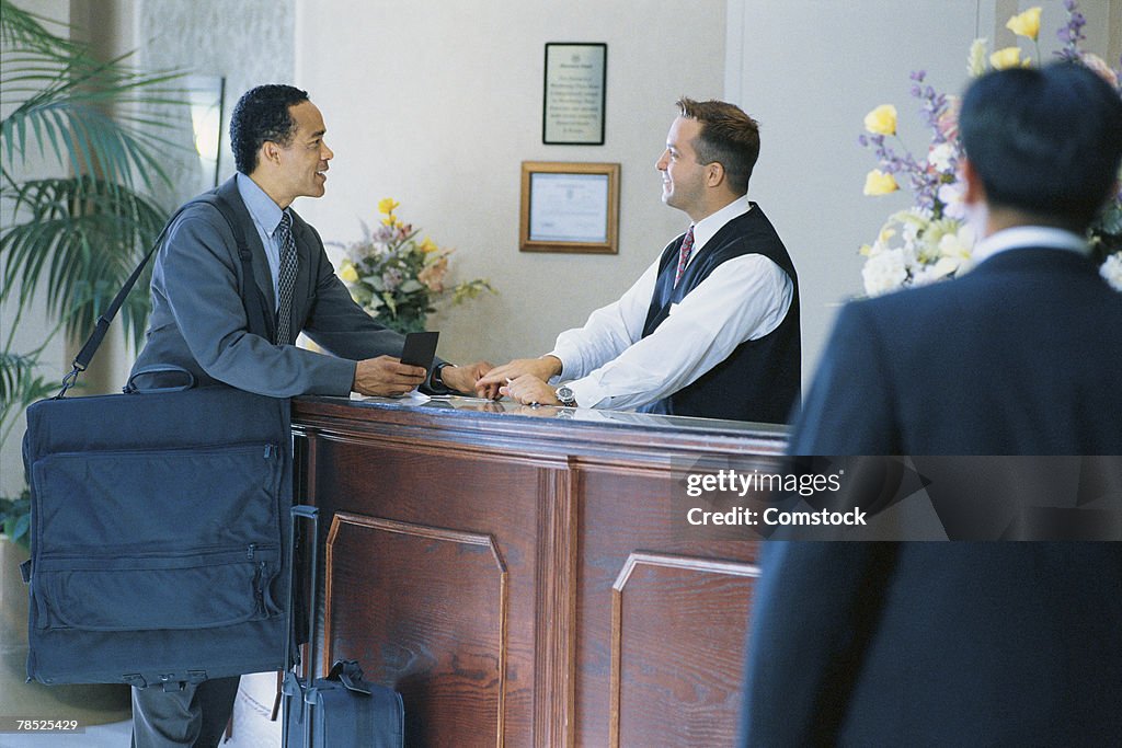 Businessman at concierge desk
