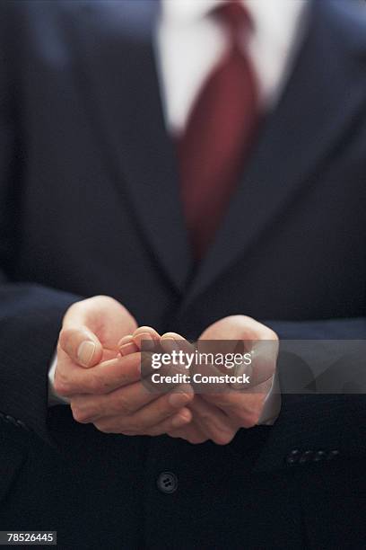 businessman holding out empty hands - hands cupped empty ストックフォトと画像