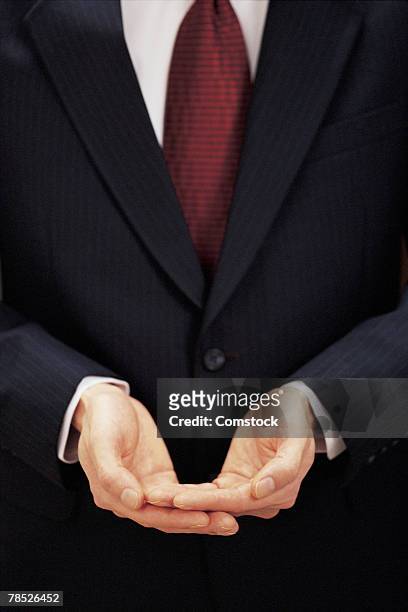 businessman's empty hands - hands cupped empty stockfoto's en -beelden