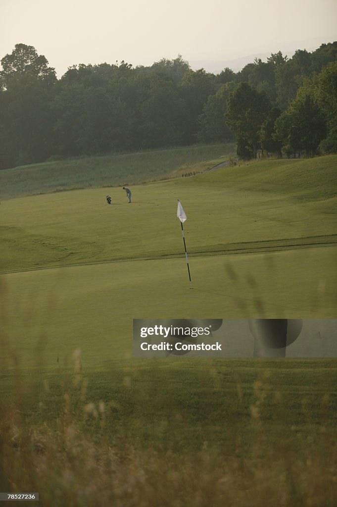 Man playing golf