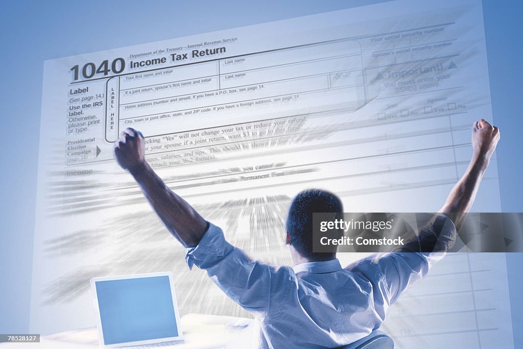 Excited man and income tax form