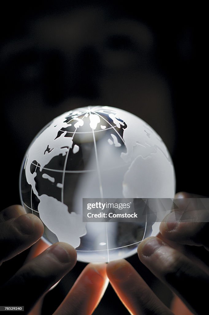 Man holding globe