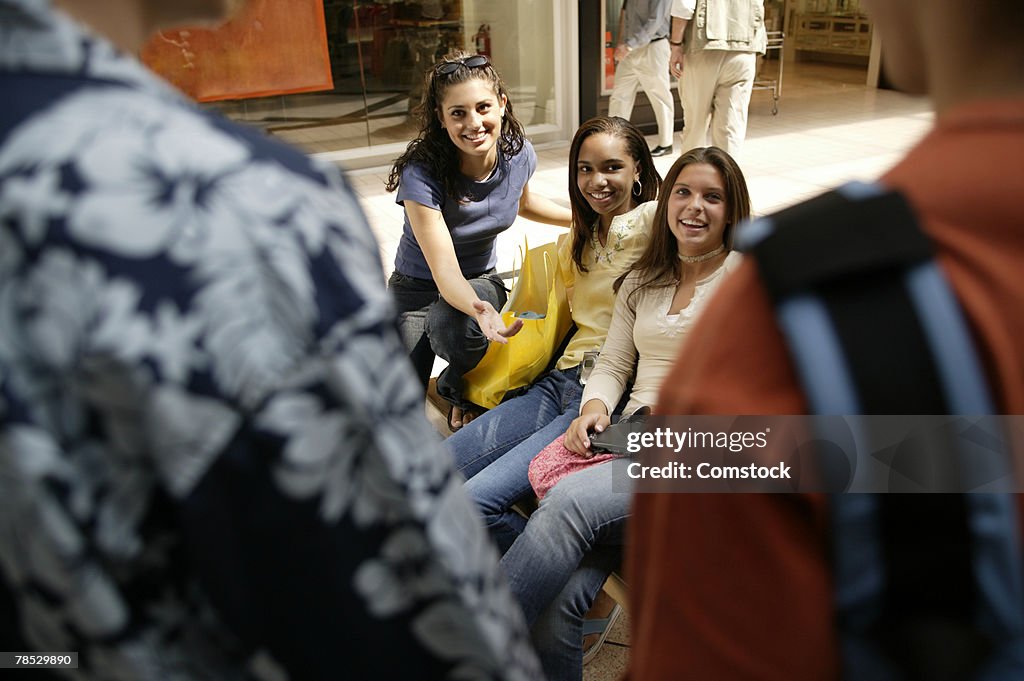 Teenage girls sitting together